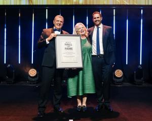 Martin (left) and Frances Dippie are inducted into the Mitre 10 Hall of Fame by Mitre 10 director...