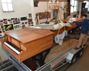 Dunedin piano maker Adrian Mann secures the world’s longest piano on a trailer in preparation for...