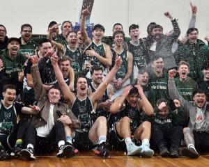 City Rise Bombers players and supporters celebrate victory in the Dunedin men’s club basketball...