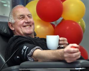 David Bond prepares to give his 304th donation of blood — not shaken or stirred — as part of...