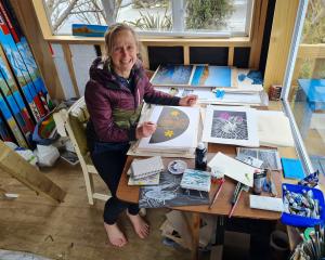 Albert Town artist Chrissy Wickes prepares art for her upcoming talk and exhibition on the...