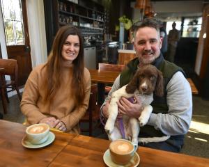 Copper on Highgate owners Morgie and Johno Lyons enjoy a coffee with their 14-week-old springer...