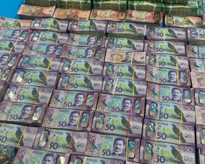 More than $1m cash was seized during an investigation into organised crime in 2021. Photo / NZ...