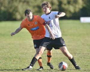 Cameron McPhail (Northern, left) and Joshua Marshall (Roslyn-Wakari) compete for possession at...