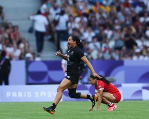 Alena Saili, of the Black Ferns, celebrates following the team's victory during the Women's Rugby...