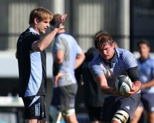 Coach Scott Robertson takes part in a drill with Ethan Blackadder during an All Blacks training...