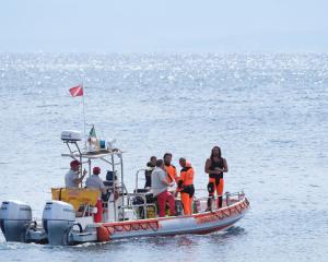 Italian emergency services headed out to sea towards the area off the Sicilian coast on Tuesday,...