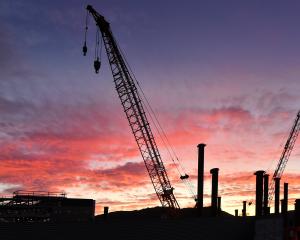 Work continues on the new Dunedin Hospital, but advice released to Health Minister Dr Shane Reti...