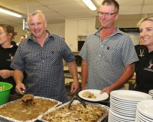 Feeding the masses ... Serving diners at a community dinner last year are North Canterbury...