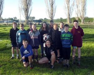 Natalie Cameron is surrounded by the farm group at Limehills School. PHOTO: SUPPLIED

