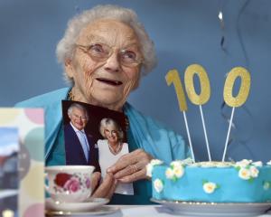Dunedin woman Irene Chapman, nee Hanson, holds a card from King Charles marking her 100th...