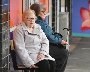 Grey Power Otago president Jo Millar (left) sits on a recently installed seat at the King Edward...