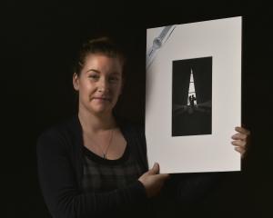 Kelk Photography owner Nicola Wilhelmsen holds her silver shot "The Couple in the Chapel", taken...