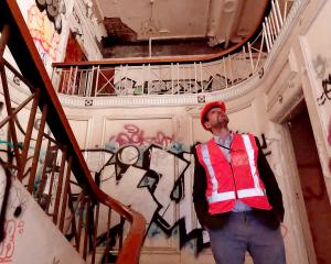 Giles Southwell examines the former theatre's stairwell. PHOTO: GEOFF SLOAN