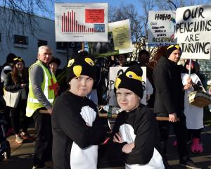 Dunedin sisters Maeva, 10, and Felicity, 8, Johnstone get ready to waddle around Dunedin to...