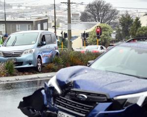 Emergency services at the scene of a two-car crash in Rattray St, Dunedin. PHOTO: STEPHEN JAQUIERY