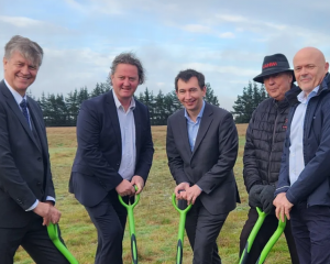 Officials including Energy Minister Simeon Brown (centre), marked the start of the solar farm's...