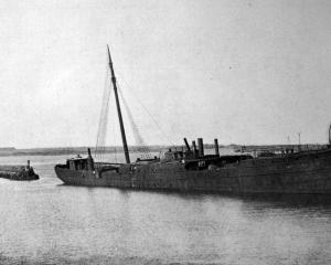 Retired steamship Te Anau rests on the harbour bed at Whanganui, after being towed from Dunedin...