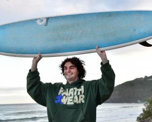 Fin Milne is pleased to get his board back after the encounter with the marine mammal. PHOTO:...