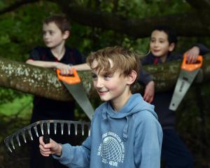 Out in nature with their tools are (from left) Jesse McKenzie, 10, of Silverstream School, Ryker...