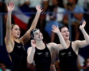 From left: Caitlin Deans, Eve Thomas and Erika Fairweather celebrate after their heat. Photo:...