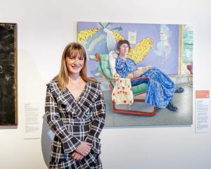 Former St Hilda's Collegiate student, Imogen Corbett, in front of her portrait of Natalia Hughes...