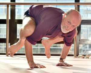 With 50 years of yoga practice and teaching under his belt, Wayne Everson pushes into a bakasana ...