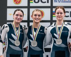 New Zealand riders (from left) Riley Faulkner, Jodie Blackwood and Caitlin Kelly receive their...