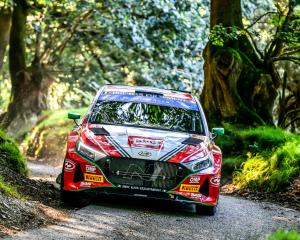 Hayden Paddon guides his Hyundai through a tricky corner at Rali Ceredigion, in Wales. PHOTO:...