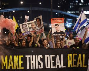 Demonstrators take part in a protest in Tel Aviv to show support for hostages kidnapped during...