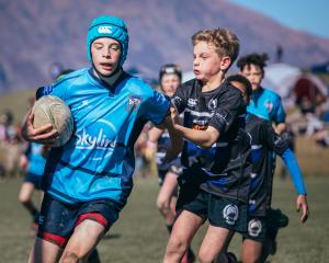 Whakatipu Rugby Club’s Callum Longthorn, 12, puts on a burst of speed to shake off Sumner club...