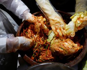 Lee Ha-yeon, a recognized kimchi grand master and her apprentices prepare kimchi at the Kimchi...