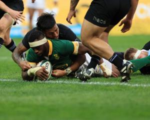 All Black Reiko Ioane can't stop South Africa captain Siya Kolisi from scoring a try. Photo:...