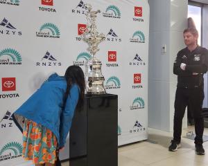 Royal New Zealand Yacht Squadron (RNZYS) cup custodian Cooper Hopman (right) keeps a close eye on...