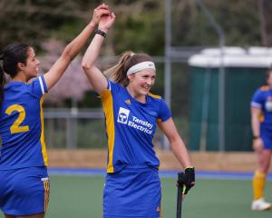 Otago players Rose Parkinson (left) and Tessa Jopp celebrate victory at the national...