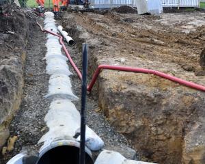 Contractors work on replacing water pipes in suburban Dunedin. PHOTO: PETER MCINTOSH