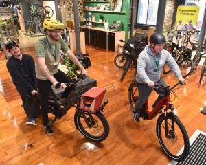 Bike House Sport employees (from left) Angus Reid, Matt Dunstan and Jeff Aldrich take one last...