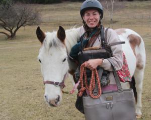 Alexandra Riding for Disabled member Keely Fowler holds a selection of the handbags that will be...