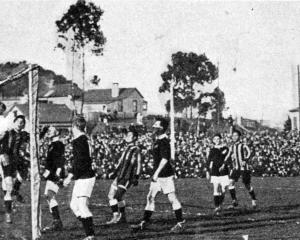 A corner kick by Ting, of the combined Chinese universities team, bounces off the crossbar in the...