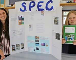 Student Micaela Laing (right) and teacher Jane McEntyre stand by material relating to the South...