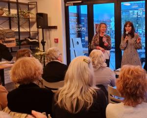 Lioness author Emily Perkins (right) reads from Lioness in Wānaka at the launch of the Queenstown...