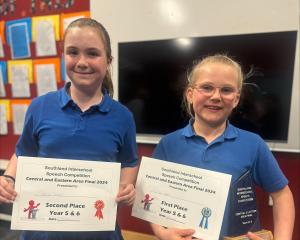 Gore Main School speech champions Gracie Sinclair (left) and Ruby Grant are ready for the grand...