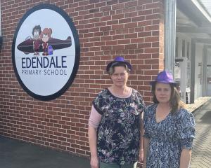 Edendale Primary School acting principal Jenny Coyle (left) and teacher Abby Duffy wear purple...