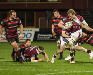 Southland replacement Blair Ryall is tackled by Canterbury’s flanker Corey Kellow at the game...