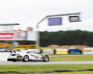 Jordan Michels, of Invercargill, takes the  chequered  flag in his Marc Ford Mustang in the class...