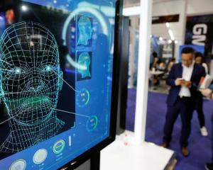 Screen advertising facial recognition software. Photo: Reuters