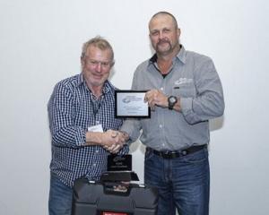 Canterbury fencer Scott Heasley is presented the Level 4 Excellence Award by Fencing Contractors...