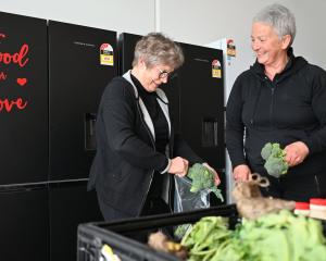 Handling fresh produce delivered to Food For Love's new premises on Gordon Rd, Wanaka, are Food...