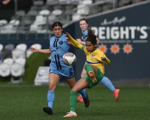 Dunedin City Royals captain Rose Morton (left) tries to defend the pass of Cashmere Technical...