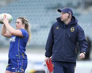 Otago Spirit coach Craig Sneddon is deep in thought as hooker Hannah Lithgow warms up before a...